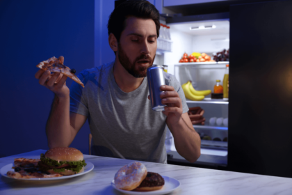 Man is eating at night