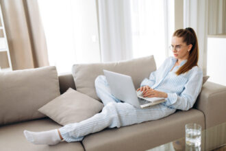 Woman working in pajamas